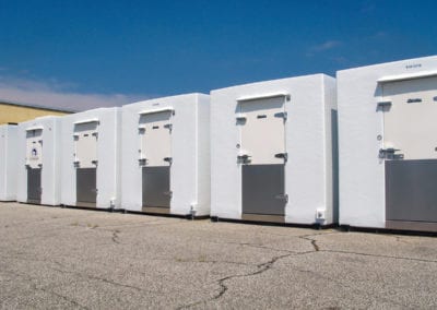 Line-up of five white polar leasing commercial refrigerators outside
